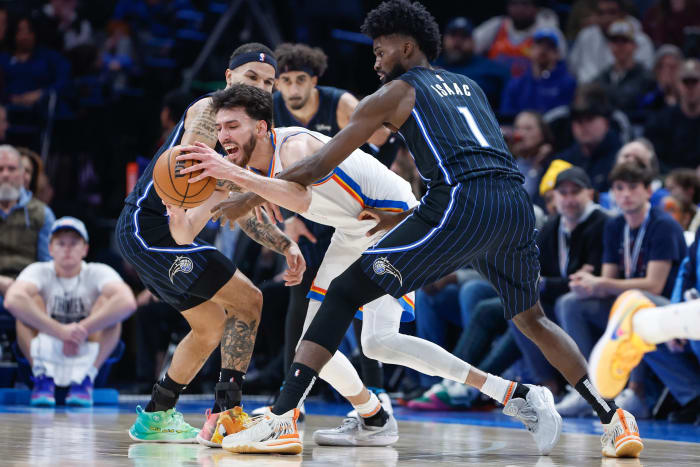 Orlando Magic's Jonathan Isaac (1) reaches in against Oklahoma City Thunder's Chet Holmgren.